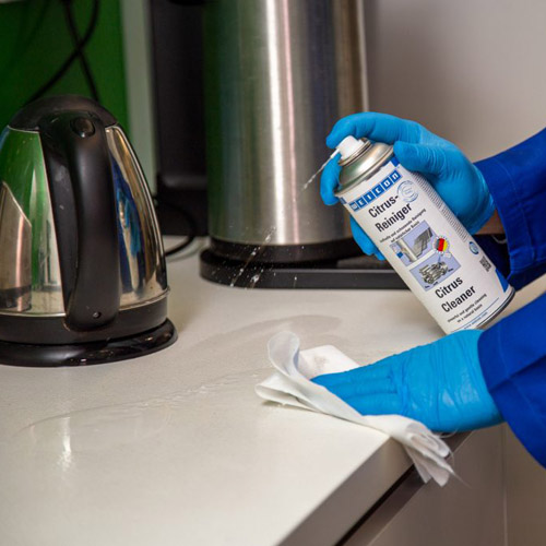 Citrus Cleaner disinfecting a kitchen benchtop